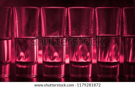 Burning cocktails in shot glass on a table
