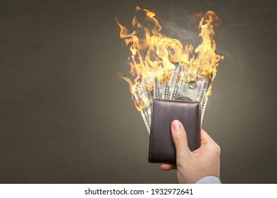 Burning Dollar banknotes inside a wallet