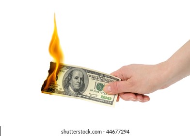 burning dollar in hand isolated on a white