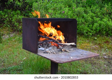 Burning Fire In A Park Fire Pit