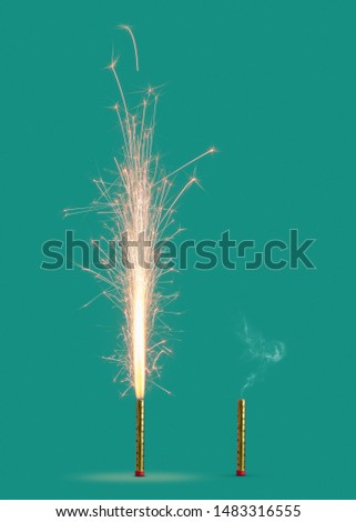 Burning firework with bright sparkes and smoke from burnt candle on a turquoise background, copy space. Concept of festive event.