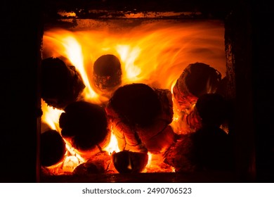 burning furnace, wood in the furnace, burning wood, inside of the furnace, lit fire, high temperature, hot, red, orange, yellow, flames, fireplace, firewood, logs - Powered by Shutterstock