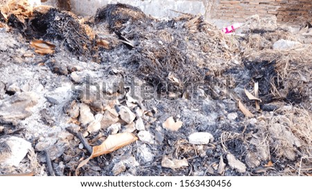Burning garbage background.Environmental problems pollution. Earth land with the garbage and from burn away the refuse.