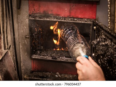 Burning Garbage In A Coal Furnace, Plastic Bottle. Problems With Smog.