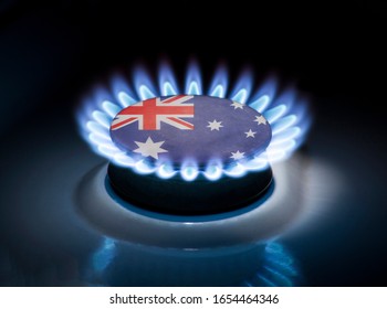 Burning Gas Burner Of A Home Stove In The Middle Of Which Is The Flag Of The Country Of Australia. Gas Import And Export Delivery Concept, Price Per Cubic Meter, Transit, Background