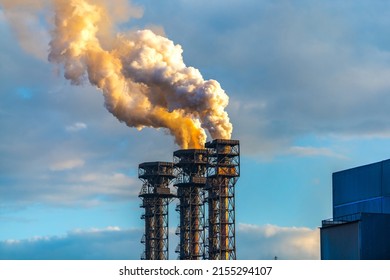 Burning gas torch with thick poisonous smoke. Gas processing and oil refinery. Air pollution! Exhaust gases, ozone depletion, greenhouse effect. 