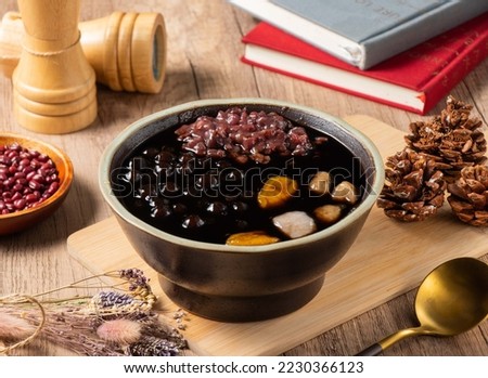 Burning Grass Jelly beans served in bowl isolated on table top view of asian food