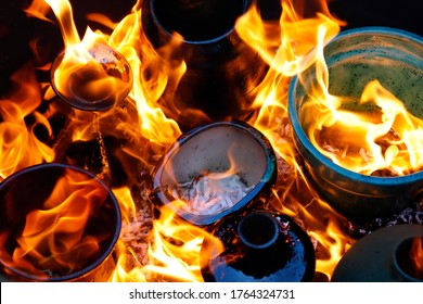burning handmade pottery in raku