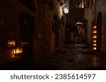 Burning Hanukkah candles cast a glow on the cobblestone streets of the Old City of Jerusalem on the eighth night of the Festival of Lights in Israel. 