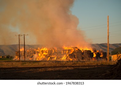 Burning Hay Stacks 1 Ton Bales On Fire Blazing Hot With Embers Flying Around Lower Yakima Valley Washington State In Farm Lands