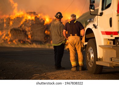 Burning Hay Stacks 1 Ton Bales On Fire Blazing Hot With Embers Flying Around Lower Yakima Valley Washington State In Farm Lands