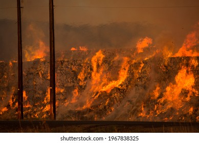 Burning Hay Stacks 1 Ton Bales On Fire Blazing Hot With Embers Flying Around Lower Yakima Valley Washington State In Farm Lands