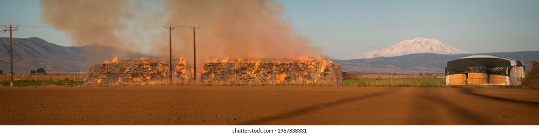 Burning Hay Stacks 1 Ton Bales On Fire Blazing Hot With Embers Flying Around Lower Yakima Valley Washington State In Farm Lands