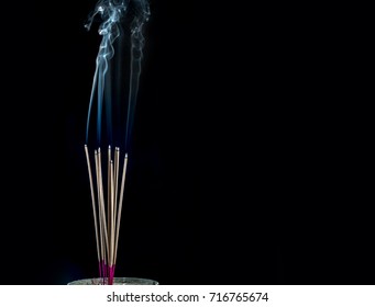 Burning Incense Sticks with smoke - Powered by Shutterstock