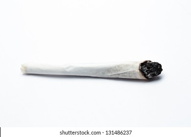 Burning Joint Of Marijuana On White Background