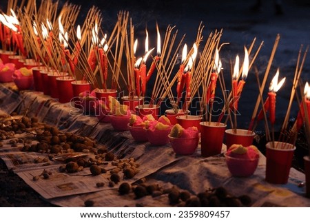 Burning for joss paper sticks fire flame amber to ashes for Chinese hungry ghost festival 