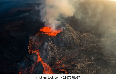 Burning lava erupts from a volcano. Volcanic eruption lava. Magma of eruption volcano. Volcanic eruption lava - Shutterstock ID 2167898627