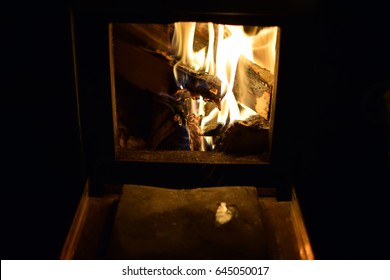 Burning Logs In Sauna Stove.