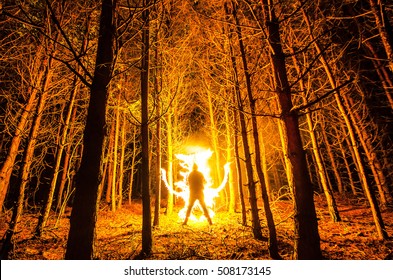 Burning man in the forest. Freezelight