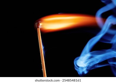 Burning matchstick with vibrant flame and smoke trails against a dark background, close-up view, dynamic motion, abstract composition, vivid light contrast - Powered by Shutterstock