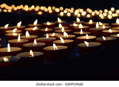 Burning Memorial Candles On The Dark Background