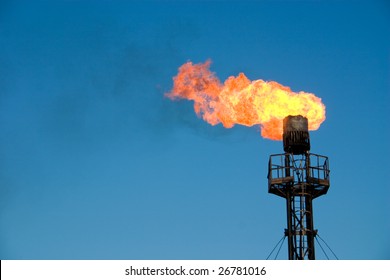Burning oil gas flare