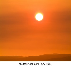 Burning Orange Sun Shines Through Smoke Haze