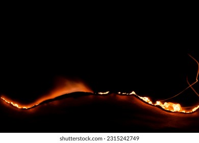 burning paper, glowing edge of paper on a black background