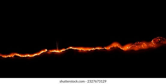 burning paper, glowing edge of paper on a black background - Shutterstock ID 2327673129