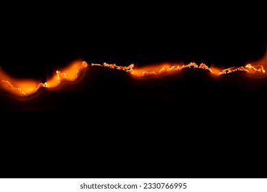 burning paper, glowing edge of paper on a black background