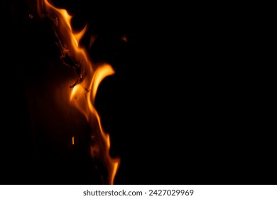 burning paper, glowing edge of paper on a black background - Powered by Shutterstock