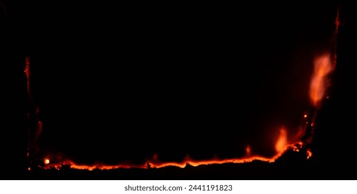 burning paper, glowing edge of paper on a black background