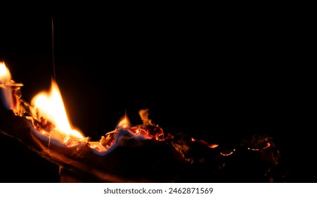 burning paper, glowing edge of paper on a black background	 - Powered by Shutterstock