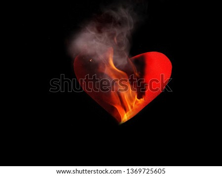 burning  red heart of fire in the dark​ ​love​ on black background