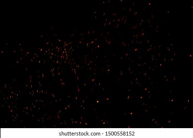 Burning Red Hot Sparks Fly From Large Fire In The Night Sky. Beautiful Abstract Background On The Theme Of Fire, Light And Life.