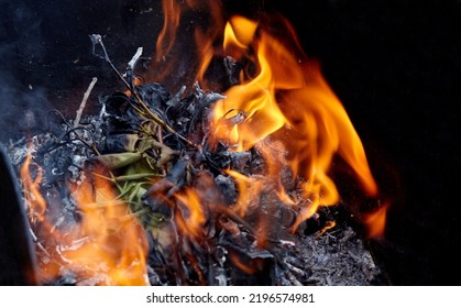 Burning Red Hot Sparks Fly From Fire. Barbecue Gril With Glowing And Flaming Hot Charcoal And Firewood