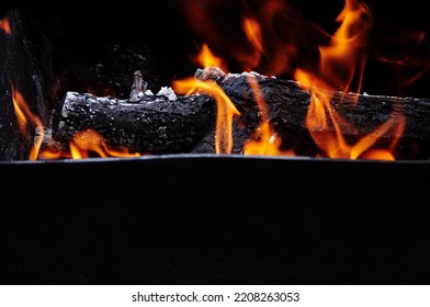 Burning Red Hot Sparks Fly From Fire. Barbecue Gril With Glowing And Flaming Hot Charcoal And Firewood