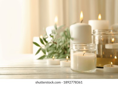 Burning Scented Candles For Relax On White Wooden Table