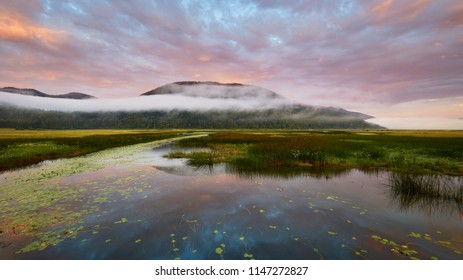 Burning Sky Over Lake Cerknica At Dawn