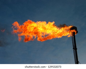 Burning and smoking oil flare