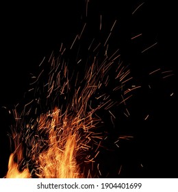 Burning Sparks Flying. Beautiful Flames Of Fire. Fiery Orange Glowing Flying Away Particles On Black Isolated Background.