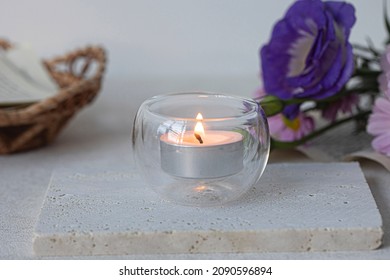 Burning Tea Lights on a white surface - Powered by Shutterstock