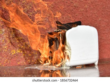 Burning Toaster. Toaster With Toast Caught On Fire Over Table.