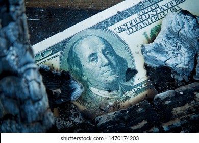 Burning US Dollar Bill As A Symbol Of Inflation, Global Financiall Crisis And Uncertain Future Of International Trade And Investment. 