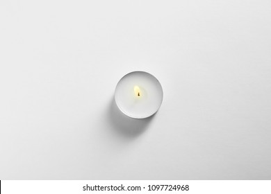 Burning Wax Candle On White Background, Top View