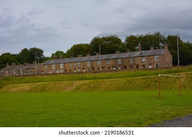  Burnley Road Loveclough Lancashire UK 07.11.2015 Row Of Terraced Houses On A682 With Trees Behind And Recreation Sports Ground To Front. Typical Properties Of Industrial Town.