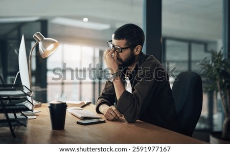 Burnout, computer and web design with man in office for website coding or programming deadline with eye strain. Night, headache and stress with tired programmer in creative workplace for overtime