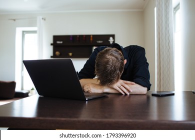 Burnout At Work. Tired And Fatigued  Office Worker Sleeping On His Work Desk While Having A Video Call Via A Computer In The Home Office. Remote Team Meeting Video Online Conference. Problems At Work