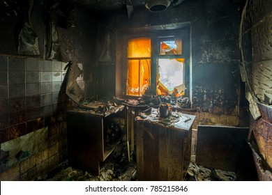 Burnt Apartment House Interior. Burned Furniture And Charred Walls In Black Soot.