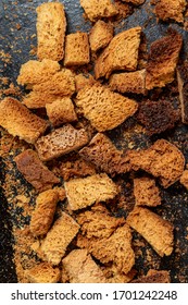 Burnt Bread Crackers. The Texture Of The Slices Of Dry Rye Bread. Crackers Or Rusks Made From Homemade White Bread Are Baked In The Oven In Close-up. Cooking Croutons.